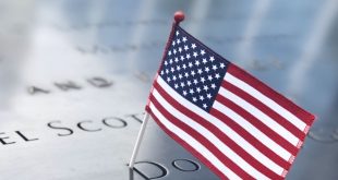 American flag on a name on the 911 World Trade Center Memorial