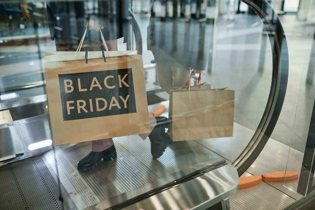 Woman Holding Black Friday Shopping Bags