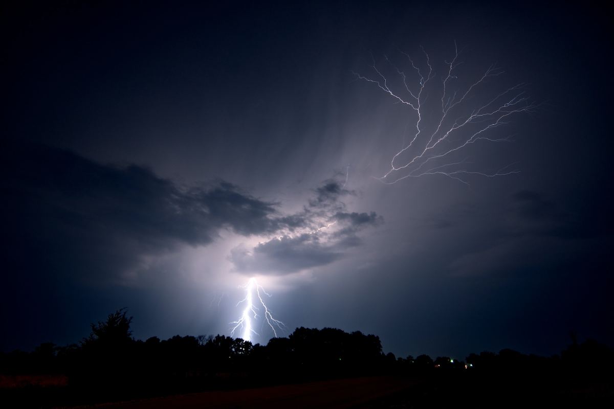 Lightning strikes the ground and spreads into the sky as a lightning crawler nears Jeanette,