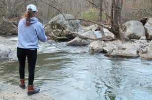 Teenage girl fishing for trout