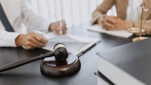 lawyer working with lawsuit in courtroom, criminal and judgement concept.