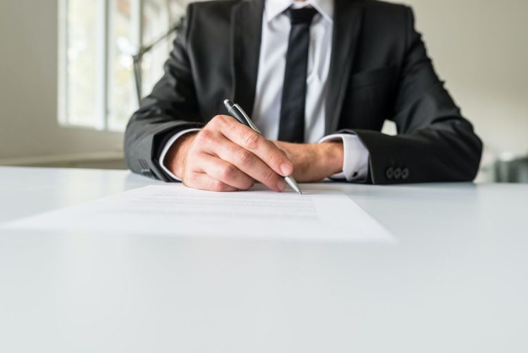 business employer signing paperwork