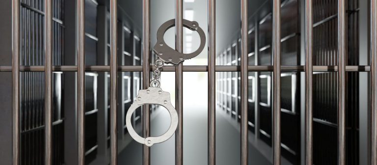 handcuffs on jail cell closed metal bar door. prison building corridor background, 3d render