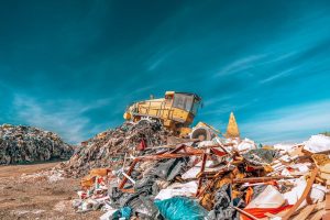 bulldozer compactor working at a landfill.