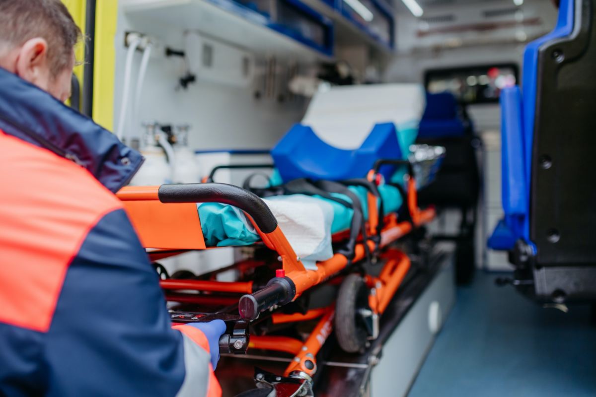 close up of empty stretcher inside ambulance vehicle.