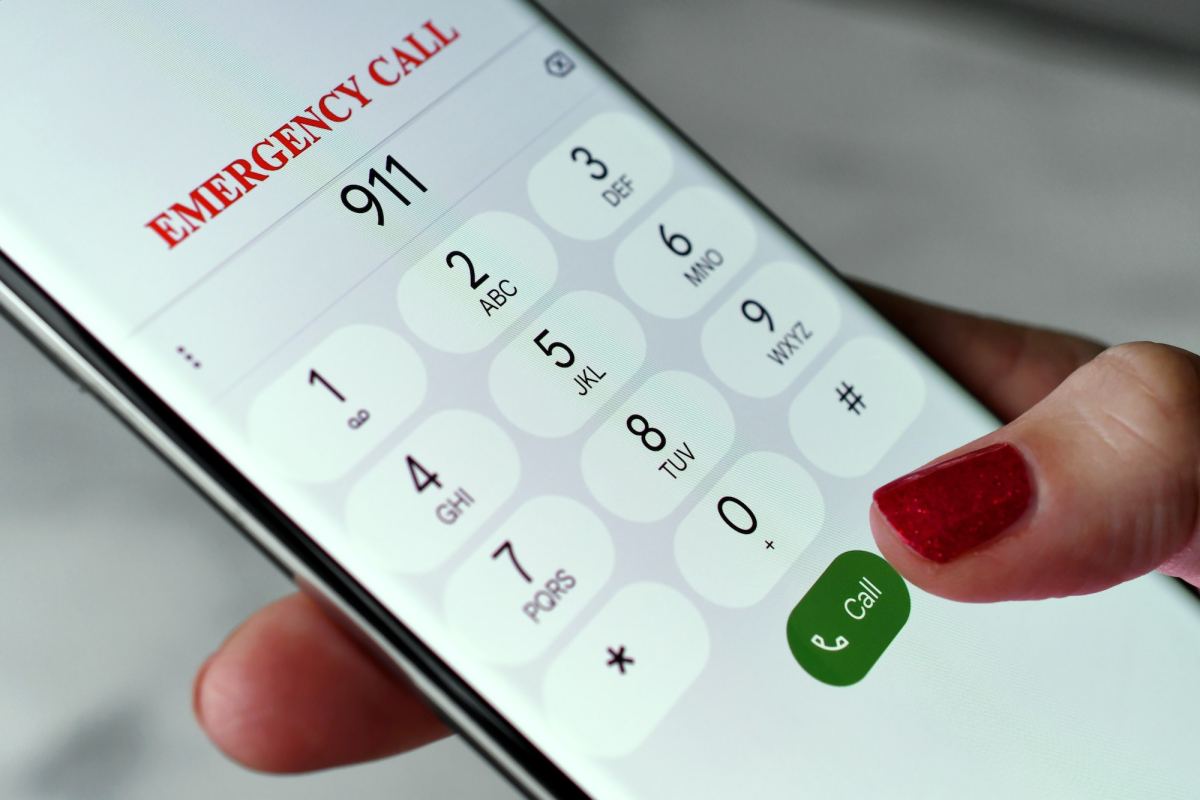 dialing 911 emergency services call on mobile cell phone police, fire department rescue emt