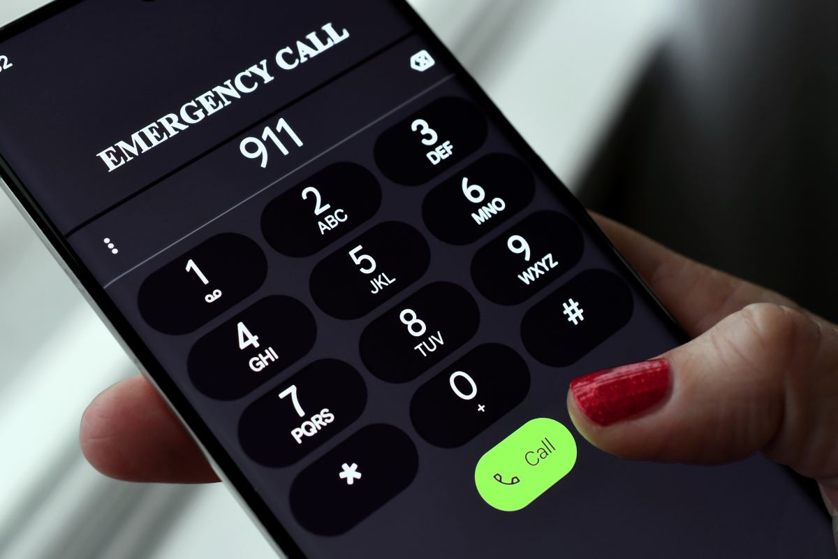 dialing 911 emergency services call on mobile cell phone police, fire department rescue emt