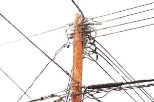 utility pole hung with electricity power cables