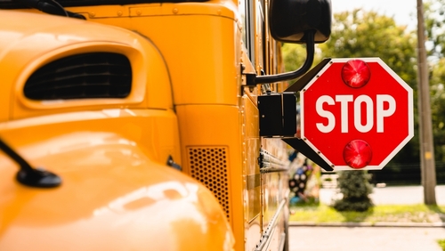 yellow,school,bus.,stop,sign.,be,careful,,schoolchildren,crossing,the