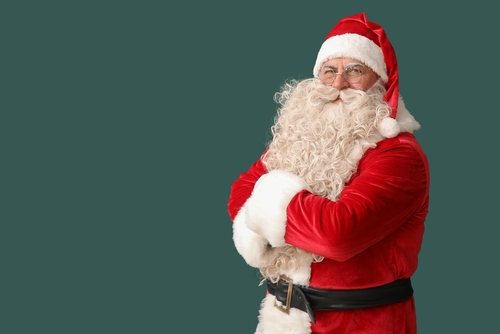 santa,claus,with,crossed,arms,on,green,background